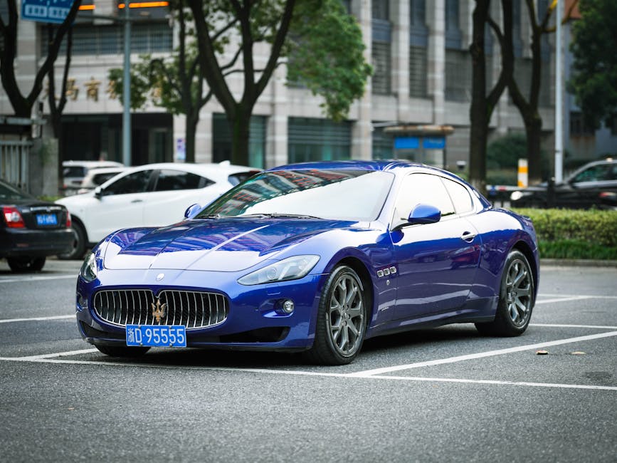 Blue Maserati sports car parked in an urban setting